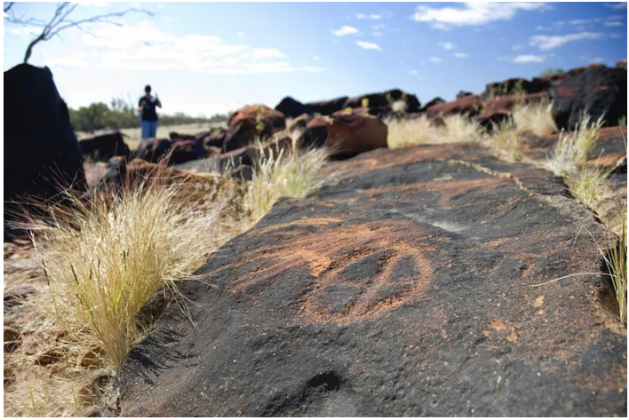 Aboriginal petroglyphs on a rockface